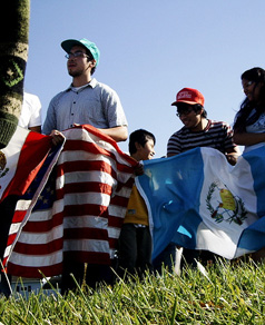 A protest in front of the Oswego Border Patrol Office was held in October, 2008 as a response to an immigration raid two weeks earlier. Under employer sanctions the effects of immigration raids on communities continue. PHOTO: Richard Vallejo