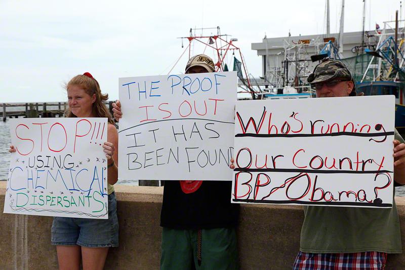 Protesters with signs against BP.